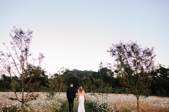 Wedding couple in garden at dusk at The Carriage Rooms